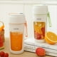 thumbnail image 4 of Licuadora Portátil Eléctrica Multifunción, Extractor de Frutas, Batidora de 6 Cuchillas, 1200 MAh, Color Naranja., 4 of 5