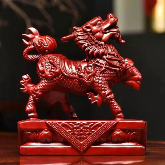 Red lucky qilin figurine, solid wood carving of male and female fire qilin, a decorative item for home living room feng shui arrangement.