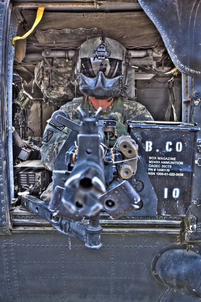 HDR image of a UH-60 Black Hawk door gunner manning a M240 machine gun Canvas Art - Terry MooreStocktrek Images (23 x 35)