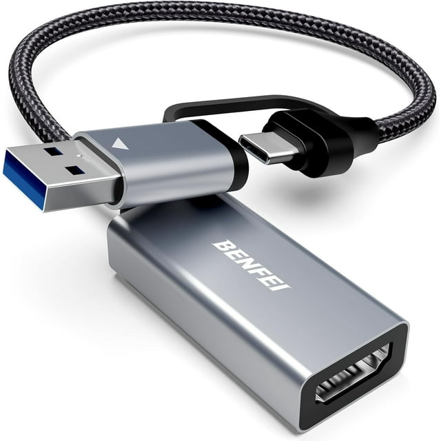 BENFEI Video/Audio Capture Card Supporting Full HD 1080P 60FPS for Streaming, Recording, Gaming. The compact grey device features a durable aluminum alloy casing with a braided nylon cable for added durability. It includes a 2-in-1 USB Type-A and Type-C connector, compatible with most laptops, PCs, and tablets. Designed for high-speed HDMI signal capture with ultra-low latency, it supports resolutions up to 4K@60Hz input and 1080P@60Hz output. Ideal for live streaming, gaming, and online meetings.