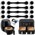 thumbnail image 1 of MORESEC 2Pcs Keep Your Parchment Paper Secure While Cooking with These Air Fryer Magnets, High-Temperature Silicone Buckles That Hold Liners in Place for Mess-Free Frying and Baking, 1 of 9