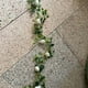 thumbnail image 4 of Guirnalda de hojas artificiales, enredadera decorativa, follaje sintético con flores, tira de 180 cm para Navidad, boda y decoración del hogar, 4 of 4