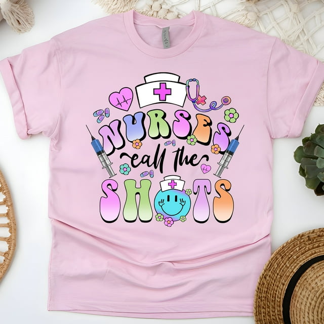 Nurses Call The Shots T-Shirt | Funny Nurse Graphic Tee with Syringe Design, Light Pink, Size S