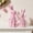 Pink, variant on JEWLALO Easter Decorations Bunny Figurines Set, Green Rattan Effect Resin Table Decor Set of 2, Spring Farmhouse Home Decor Centerpiece Statue, Indoor Easter Bunny Decor & Gift