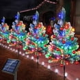 thumbnail image 1 of 4-Pack Upgraded Solar Christmas Garden Pathway Lights - Waterproof Outdoor Christmas Tree Decorations with 8 Lighting Modes for Yard, Lawn, Pathway, or Grave, 1 of 5
