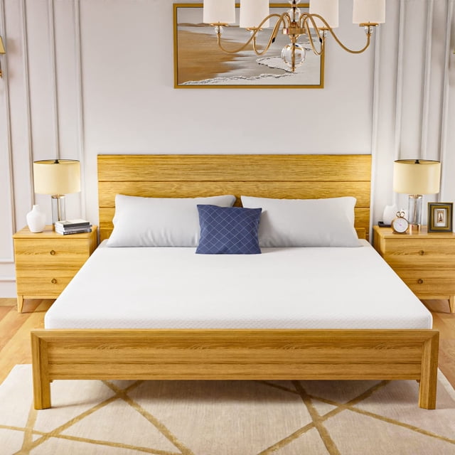 FDW King 6 Inch Medium-Firm Gel Memory Foam Mattress, CertiPUR-US Certified, in a Box, Bamboo Charcoal Infused, displayed on a wooden bed frame in a well-lit bedroom. The mattress features a smooth white cover and is complemented by white and blue pillows. The bamboo charcoal-infused gel memory foam provides medium-firm support, is antimicrobial, and resists allergens. The room includes matching wooden nightstands, table lamps, and a decorative wall painting.