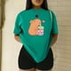 thumbnail image 3 of Playera Blusa De Capybara Tomando Refresco Ropa Divertida Para Mujer Capibara Color Verde Talla Chica Marca Emil SaEs, 3 of 4