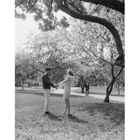Posterazzi SAL255422736 Young Couple Holding Hands in Park Poster Print - 18 x 24 in.