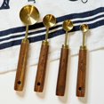 thumbnail image 2 of Everything Kitchens Modern Essentials Gold Measuring Spoons with Wood Handles | Set of 4, 2 of 13