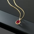 thumbnail image 4 of Gem Stone King 10K Yellow Gold Red Created Ruby and White Diamond Pendant Necklace for Women (2.04 Cttw, Oval 9X7MM, with 18 inch Chain), 4 of 5