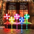 thumbnail image 3 of Juego de 5 piruletas solares para caminos navideños ILLUMINEW, 3 of 7