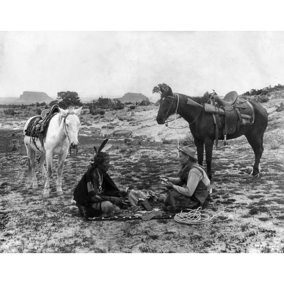 Playing Cards, C1915. /Na Cowboy And A Native American Man Seated On A Blanket And Playing Cards On The Great Plains. Photograph, C1915. Poster Print by  (18 x 24)
