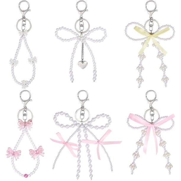Llaveros de 6 estilos: llavero de platino con dijes y colgantes de perlas blancas, lazos de colores, llavero con clip y cuentas.