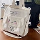 thumbnail image 3 of Bolso de hombro MBTI con bonitos dibujos animados para mujer, bolso de mano informal de gran capacidad con estampado de Cinnamoroll, bolso de mano de nailon de moda japonesa para mujer, 3 of 4
