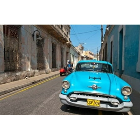 Cuba Camaquey Oldsmobile car and buildings Canvas Art - Bill Bachmann DanitaDelimont (36 x 24)