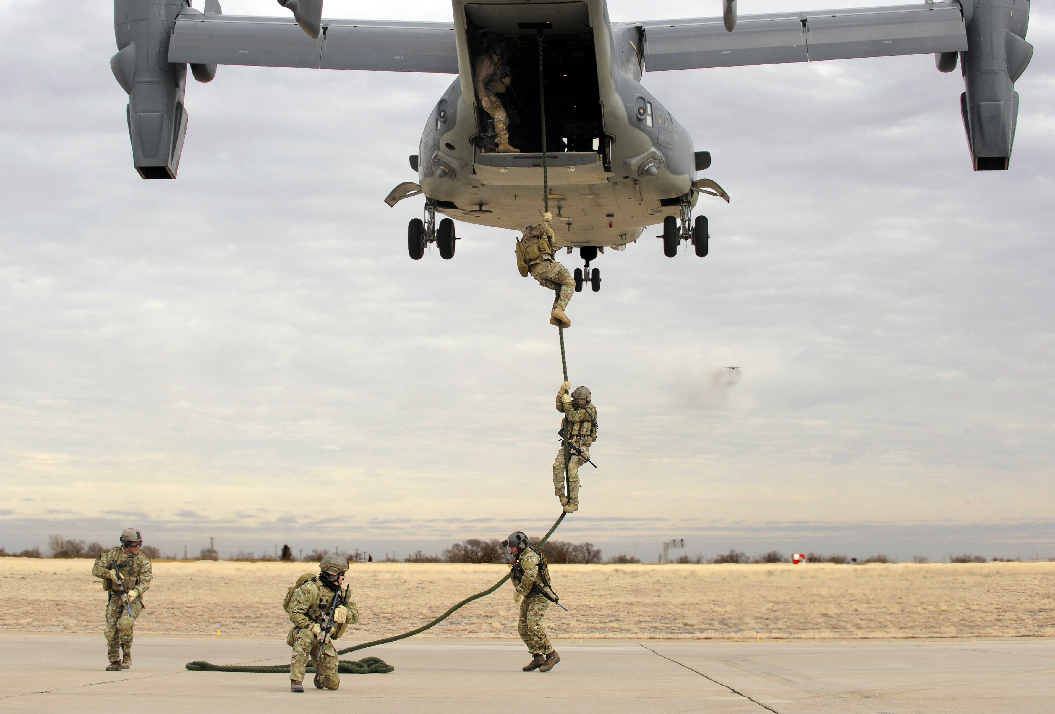 Laminated Poster Soldiers Of The 7th Special Forces Group Fast Rope From A Cv 22 Osprey During