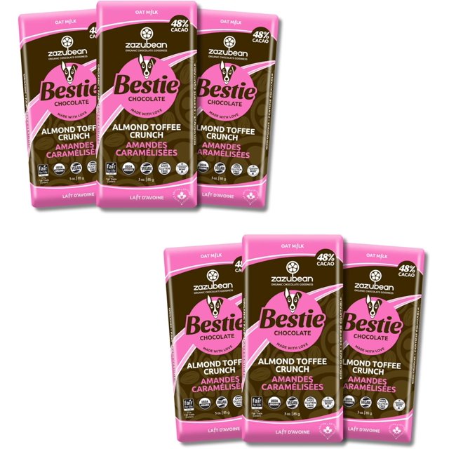 Zazubean Organic Chocolates Bestie Almond Toffee Crunch Oat Milk Chocolate Bars, displayed as a set of six 85g bars. The pink and brown wrappers feature 48% cacao, caramelized almonds, and oat milk, emphasizing their vegan, gluten-free, soy-free, kosher, USDA Organic, and Fair-Trade certifications. Ideal as a snack or comfort food treat.