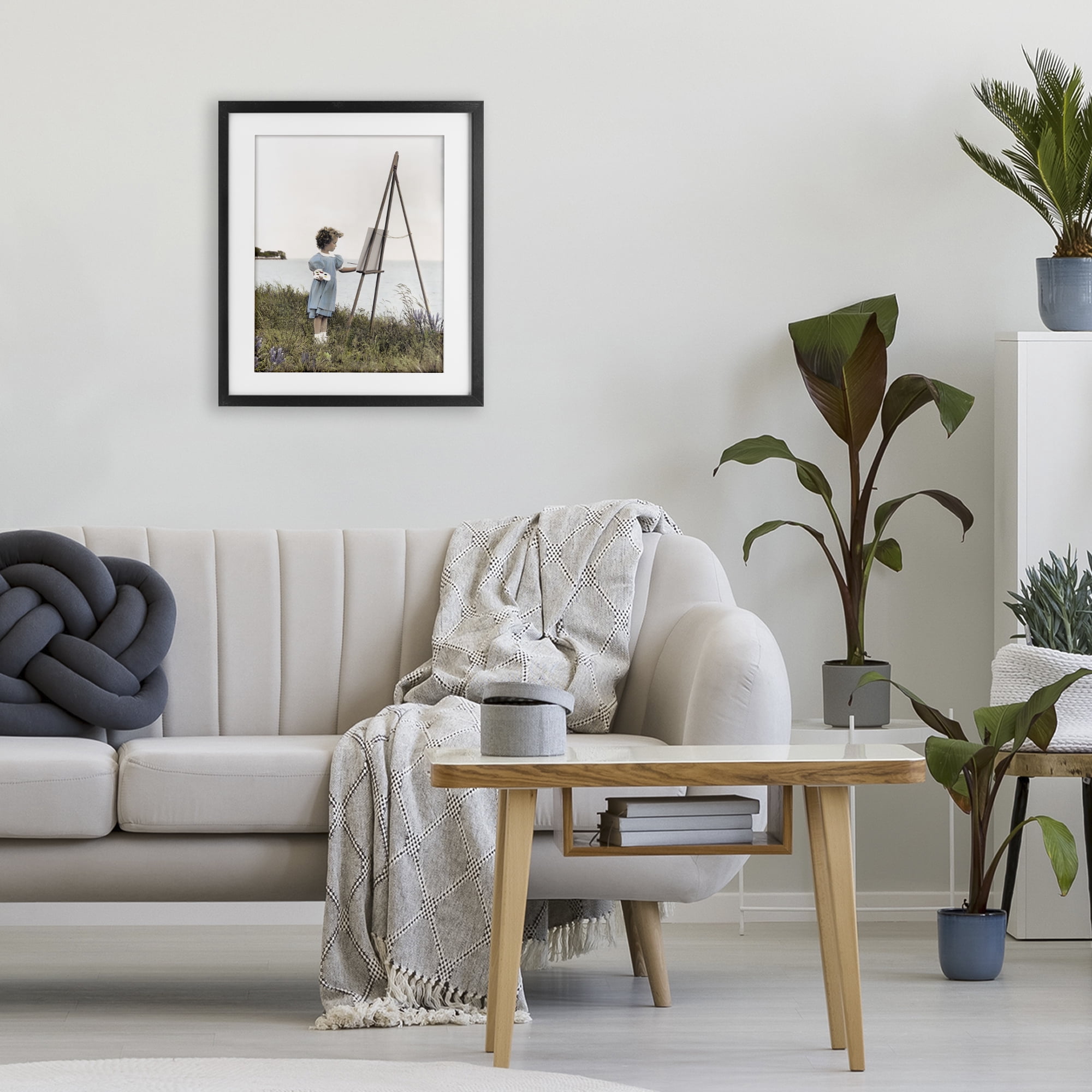 Stupell Industries Child Painting on Easel Black Framed Print Under Glass, design by Kendra Dew