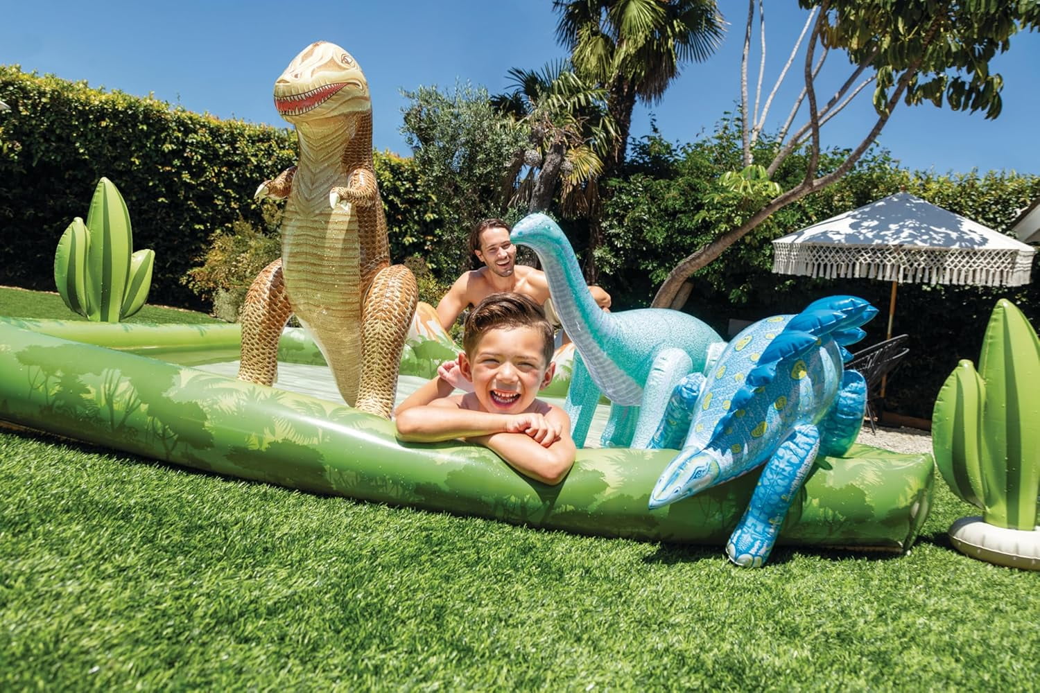 Jurassic Adventure Inflatable Kiddie Pool with Water Sprayer, Slide & Dinosaurs - 79" x 79" x 14" - Ages 2+