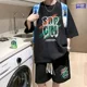 thumbnail image 3 of Conjunto de 2 piezas de chándal sencillo con diseño de gofre para hombre y mujer, camiseta y pantalones cortos de diseño urbano holgados de verano, ropa deportiva informal con diseño de parche, 3 of 5