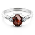 thumbnail image 2 of Gem Stone King 925 Sterling Silver Red Garnet and White Created Sapphire 3-Stone Rings for Women (1.61 Cttw, Gemstone January Birthstone, Oval Checkerboard 8X6MM, Available in Size 5, 6, 7, 8, 9), 2 of 4