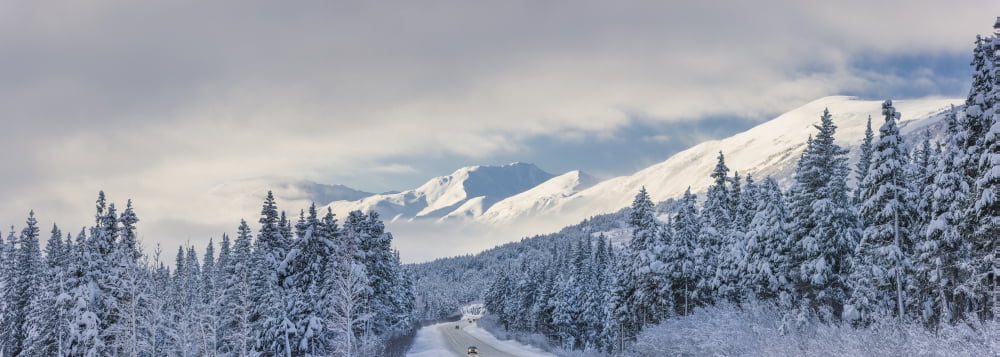 Clouds Clearing Over Seward Highway From The Kenai Mountains Above Turnagain Pass After A Winter Snow Storm Fresh Snow In The Trees Early Morning Sun Turnagain Pass Chugach National Forest Southcentra