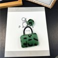 thumbnail image 1 of Llavero con estampado de leopardo para bolso, colgante creativo de peluche de dibujos animados para estudiantes, llavero para coche, colgante de bola de piel, accesorios, 1 of 6