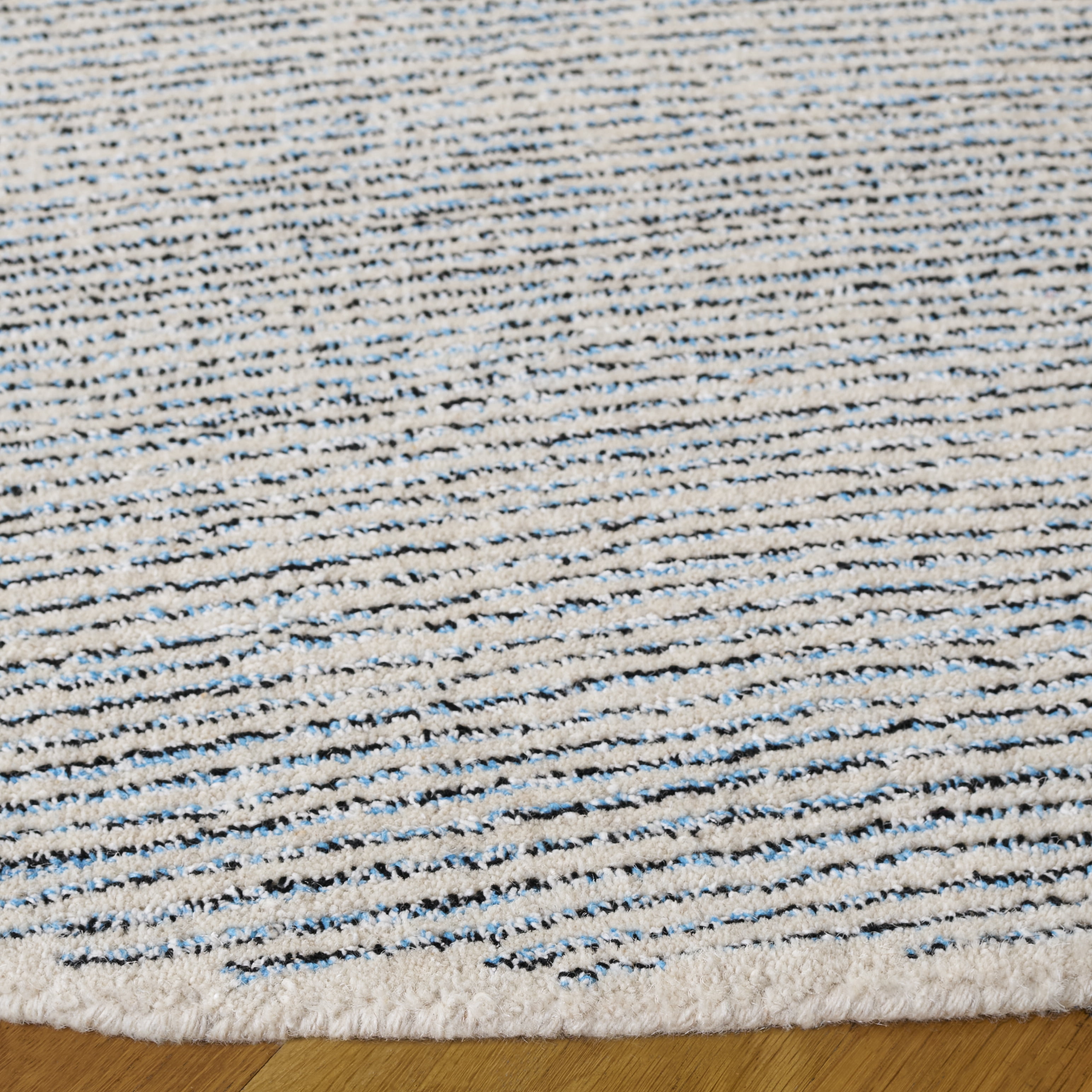 SAFAVIEH Abstract Rumen Solid Color Area Rug, Blue/Black, 6' x 6' Round