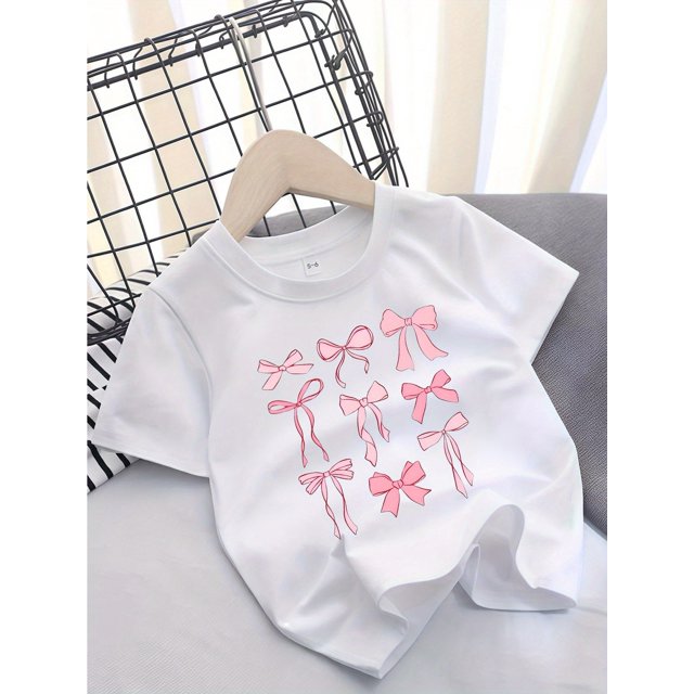Camiseta informal de manga corta con cuello redondo para niña con estampado de lazo, tejido de punto de algodón ligeramente elástico, corte regular para niñas de 12 años o menos.