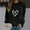 Black cheap stuff under 5 dollars, variant on Dyegold Women's Long Sleeve Tops Sales Y2k Western Casual Pullover Heart Printed Vintage Graphic Jacket Winter Plus Size Comfy Hoodie Ladies Oversized Tops Workout Teen Girls Sweatshirt