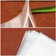 thumbnail image 4 of Juego de 100 Piezas de 5 Bolsas Gruesas Transparentes de PE Auto Sellantes con Bordes Rojos: Excelente Sellado y Resistencia Ideal Almacenamiento, 4 of 8