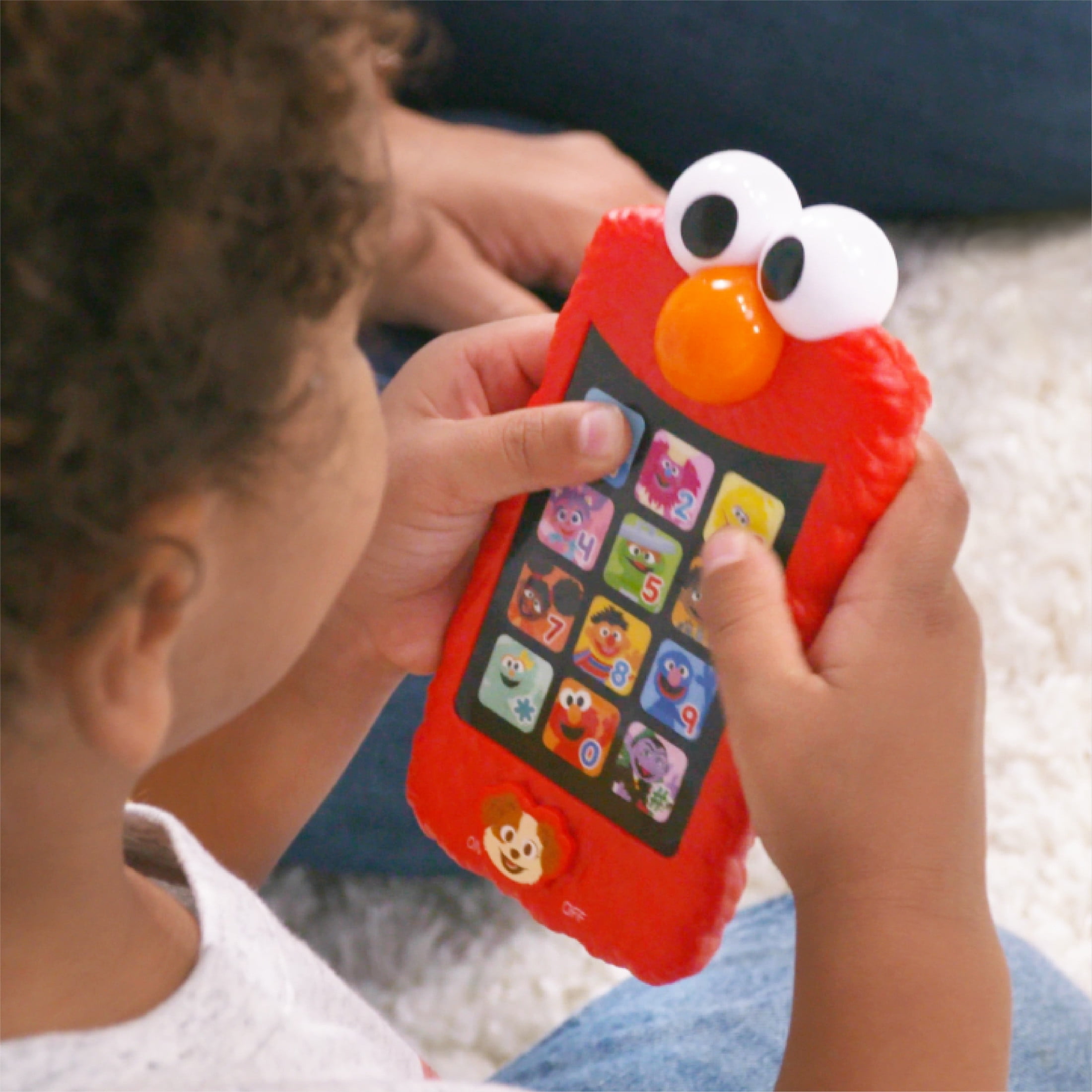 Let's Pretend Elmo interactive toy published by shops Sesame Street and Mattel.