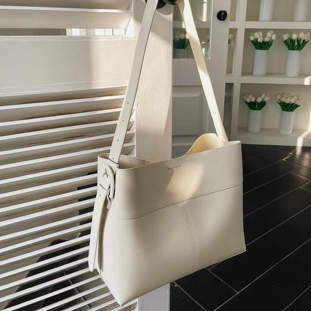 Bolsos de mano coreanos de Piel de vaca Natural para mujer bolsos y monederos de diseñador de lujo novedad de 2024