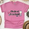 thumbnail image 1 of Medical Assistant Shirt | Stethoscope Syringe Healthcare Tee, Heliconia, Size 3XL, 1 of 6