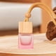 thumbnail image 4 of Ambientador colgante para coche, frasco difusor de perfume con tapa de madera y organizador. Rosa, 4 of 7
