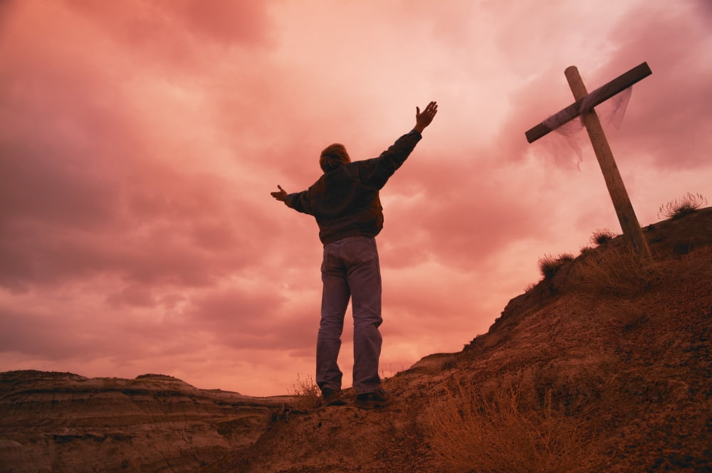 Man At Cross With Raised Arms Poster Print by Don Hammond Design Pics