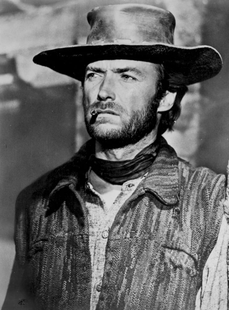 Clint Eastwood Looking Away in Cowboy Attire with Cigarette in His