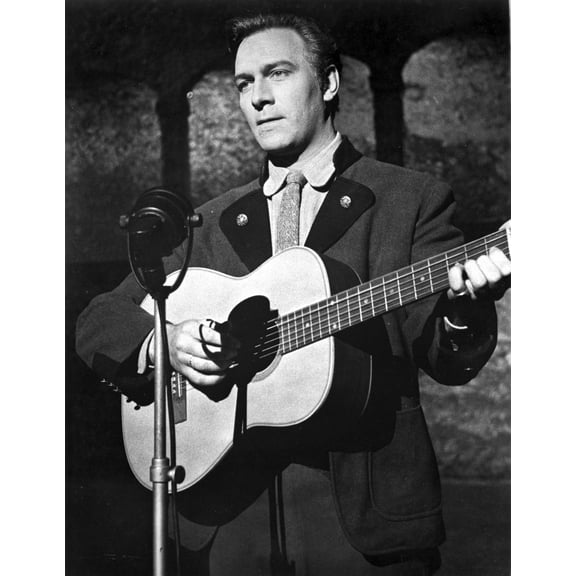 Christopher Plummer playing a guitar on stage Photo Print (24 x 30)