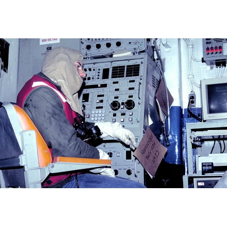 LAMINATED POSTER A crew member monitors computerized controls of the Phalanx close-in weapons system (CIWS) during a Poster Print 24 x