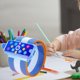 thumbnail image 1 of de muñeca antigancho Corrección de postura de escritura Longitud ajustable Cómodo de usar Corrección de postura de agarre para niños en edad azul Macarena corrector de muñeca anti gancho, 1 of 8