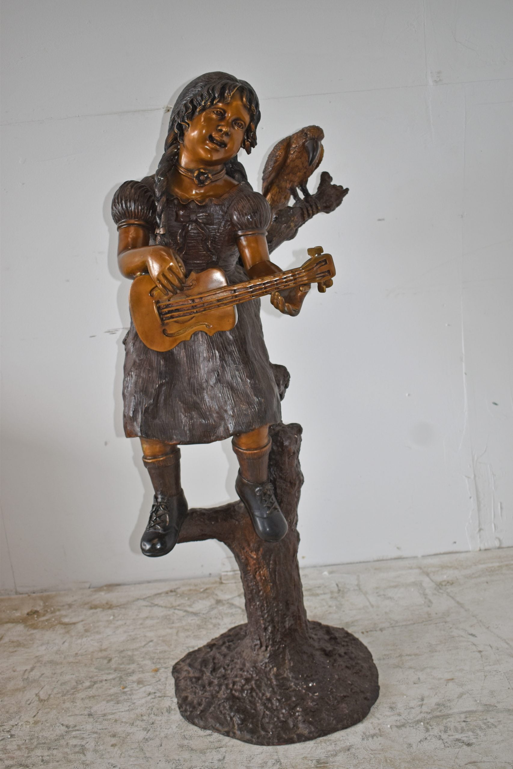 Nifao Girl on a Tree Playing the Ukulele with a Parrot Bronze Statue – Garden Outdoor Decor Sculpture, 25"L x 23"W x 50"H