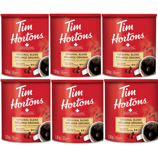 Tim Hortons Original Blend Fine Grind Coffee Large, 1.36 kg (6/Case). Six red containers of ground coffee featuring a medium roast made from 100% Arabica beans, ideal for automatic coffee makers. Each container displays the Tim Hortons logo and product details prominently.