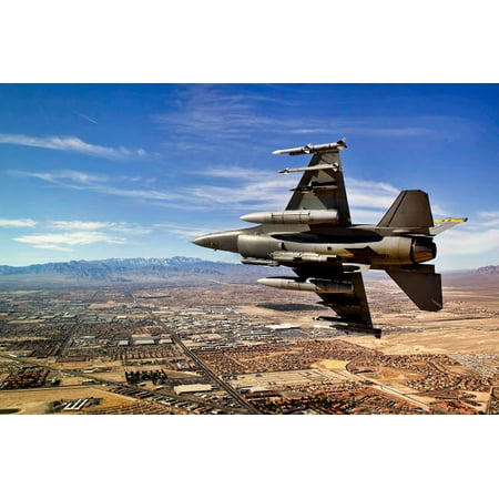 A fighter jet breaks right on a final approach over northern Las Vegas Nevada Poster Print by Stocktrek