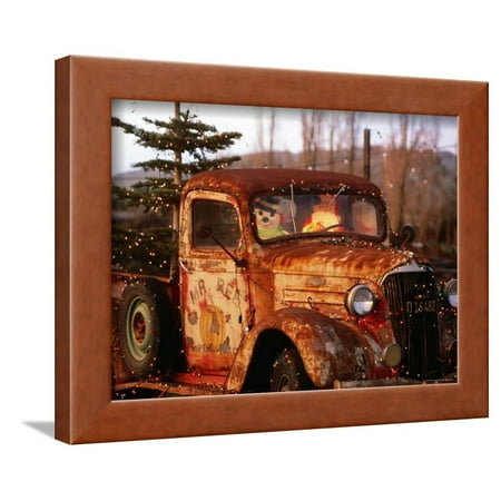 Rusty Old Truck Strung with Christmas Lights, with Santa Claus at Wheel Framed Print Wall Art By Judy (Best Paint For Rusty Truck Frame)