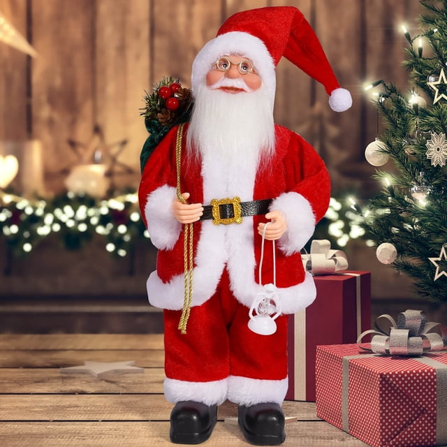 Figurine de Père Noël Debout sur une Grille d'Eau avec Épinette Vert et Baies Rouges pour l'Hiver