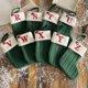 thumbnail image 4 of Calcetines navideños con letras rojas, blancas y verdes, adornos para árboles de Navidad, bolsas de regalo para decoración del hogar, Año Nuevo, 2024, 4 of 4