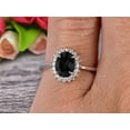 thumbnail image 4 of 1.50 Carat Oval Cut Black Diamond Moissanite Engagement Ring With 10k White Gold Halo Flower Prong Set, 4 of 5