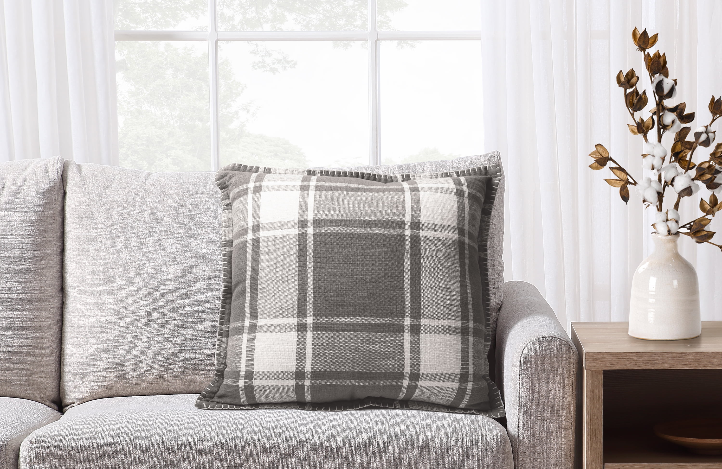 Grey and store white plaid pillows