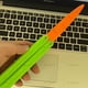 thumbnail image 1 of Cuchillo mariposa de gravedad con salto recto, cuchillo luminoso con forma de rábano, mini cuchillo mariposa con forma de zanahoria, juguete, 1 of 6