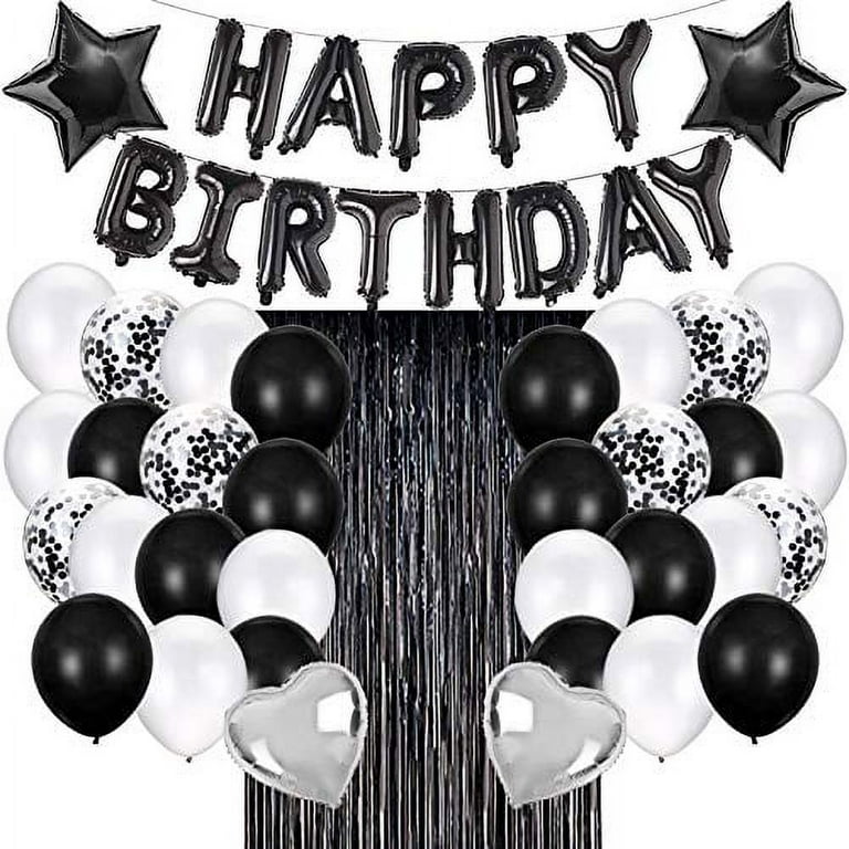 Festive birthday party decor. Minimalistic style. Black and white balloons  hang over number 10 in the restaurant hall Stock Photo